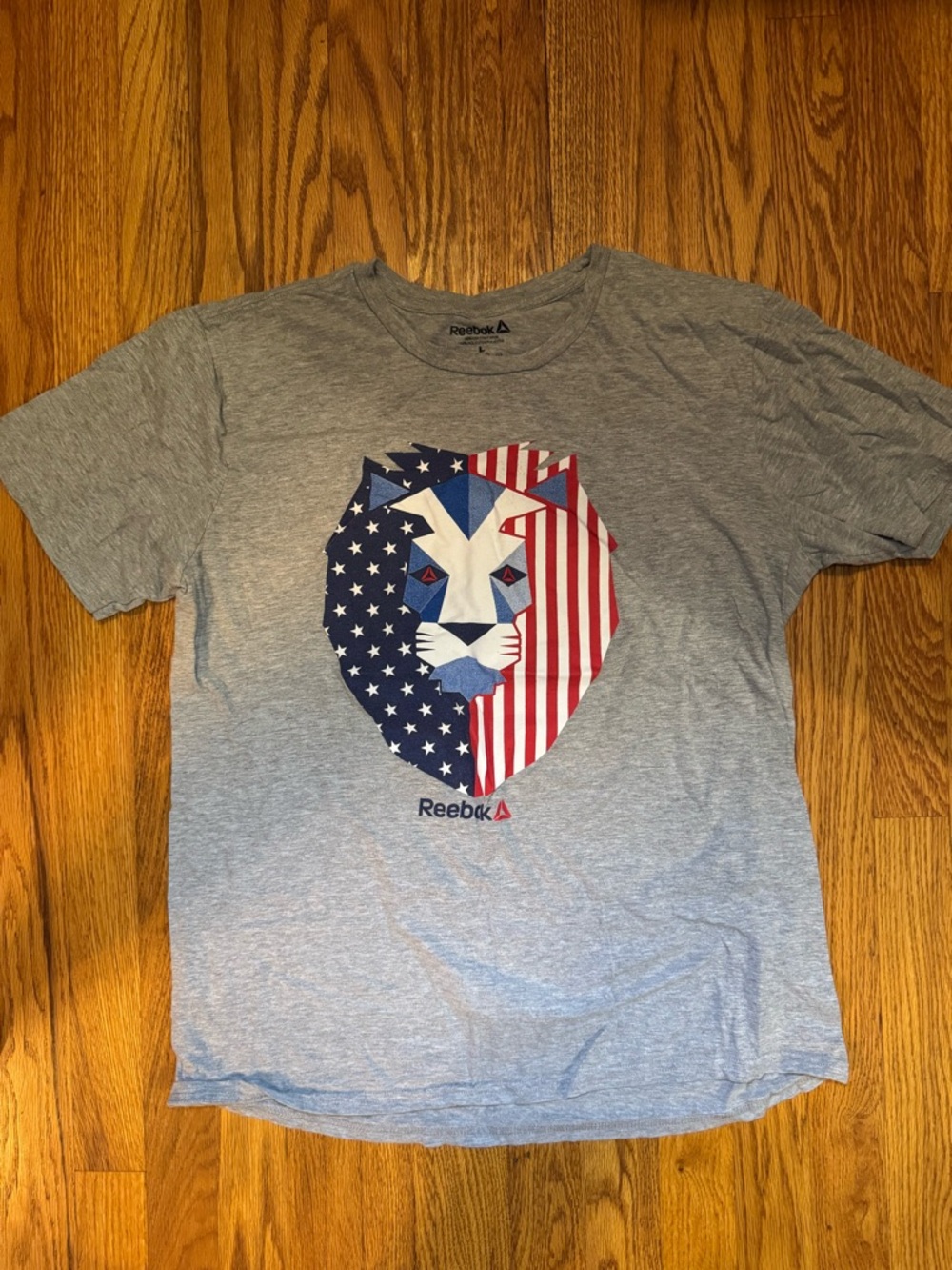 Reebok Gray Tee with Red White and Blue Patriotic Lion Graphic
